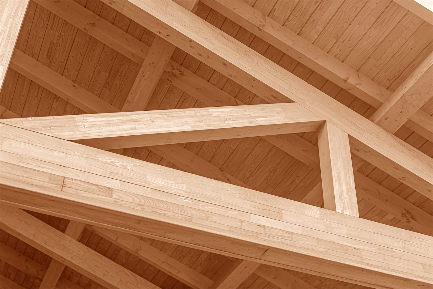 Exposed Glulam beams creating a long, clear span for a roof structure